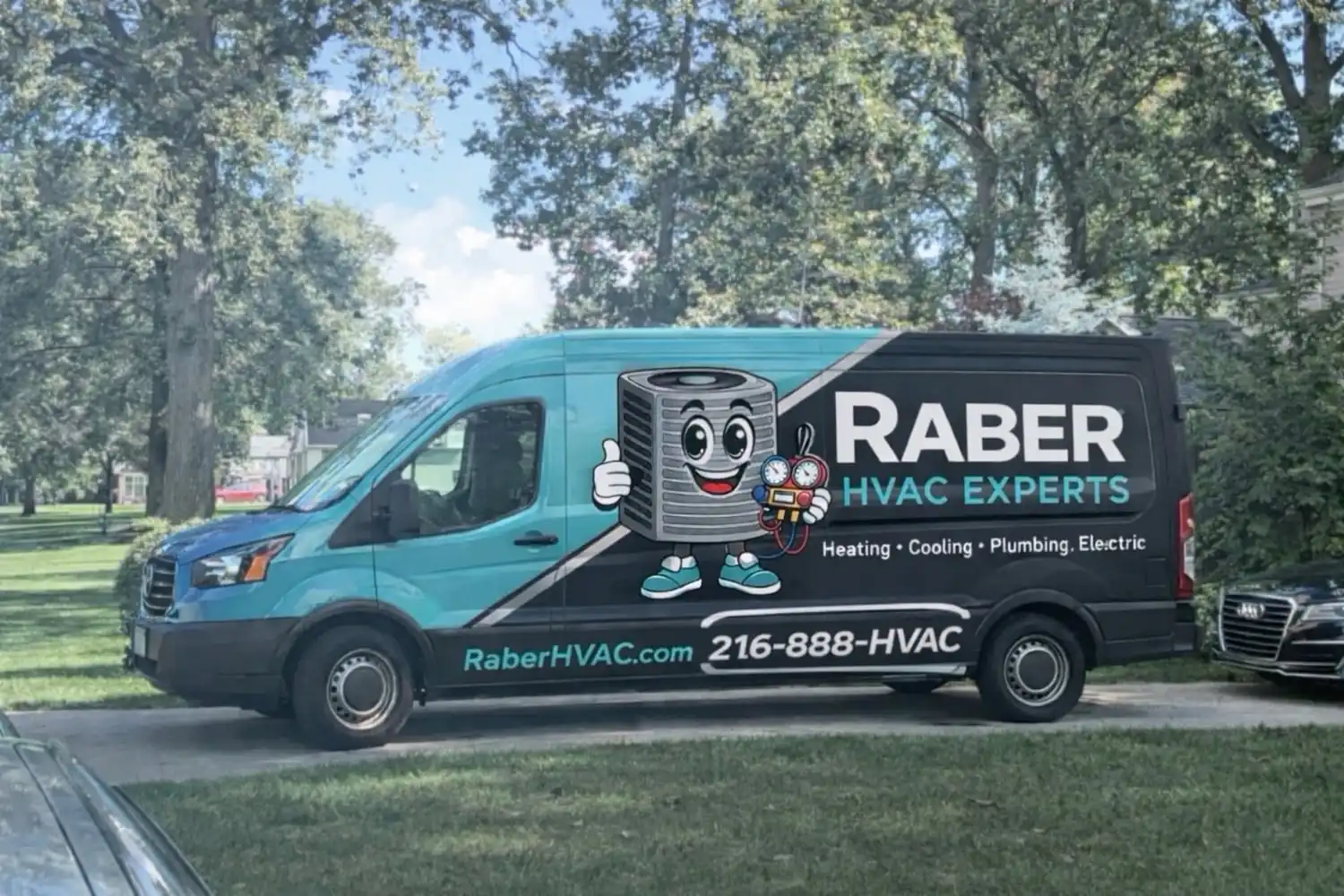 Raber HVAC Experts service van in teal and charcoal livery parked on a tree lined residential street